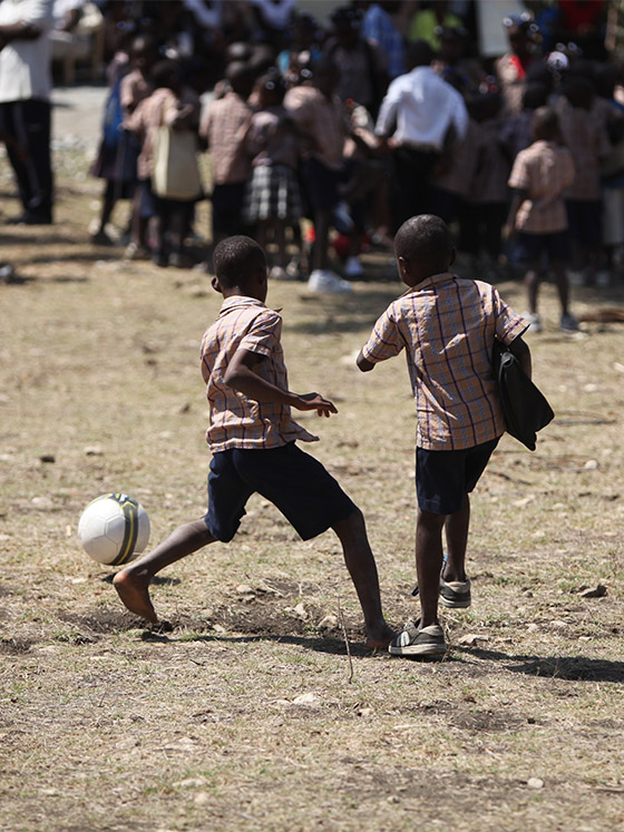 boys in haiti playing soccer